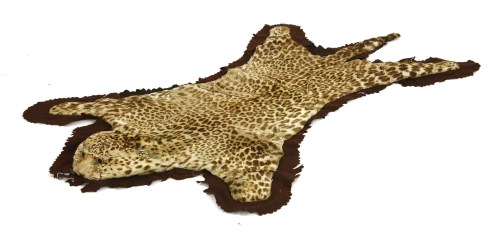 Lot 1033 - A 19th century leopard skin rug
