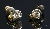 Lot 436 - A pair of 18ct gold single stone diamond stud earrings