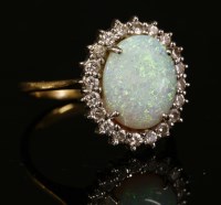 Lot 330 - An opal and diamond oval cluster ring