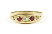 Lot 208 - A 18ct gold five stone graduated diamond and ruby boat shaped ring