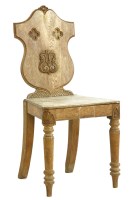Lot 1040 - A Gillows type oak shield back hall chair