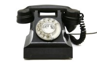 Lot 735 - An old black bakelite telephone