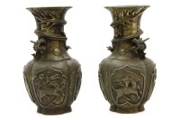 Lot 646 - A pair of oriental bronzed vases