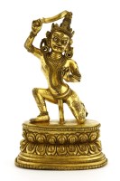 Lot 1244 - A Tibetan gilt bronze bodhisattva