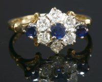 Lot 234 - A 9ct gold sapphire and diamond cluster ring