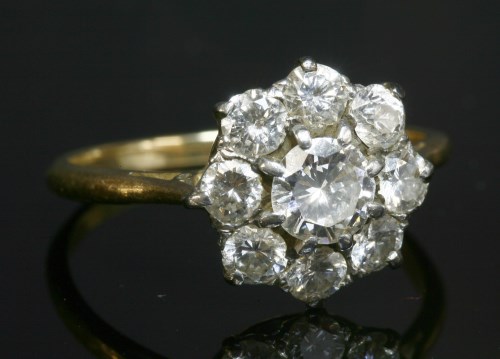 Lot 424 - A five stone diamond cluster ring