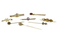 Lot 233 - A collection of brooches and stick pins