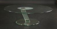 Lot 367 - A contemporary oval glass coffee table
on an arching support and stepped base