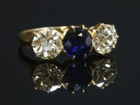 Lot 92 - A three stone sapphire and diamond ring