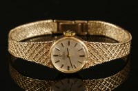 Lot 623 - A ladies' 9ct gold Omega automatic bracelet watch