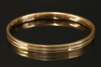 Lot 687 - An Art Deco 9ct gold hollow flat section slave bangle