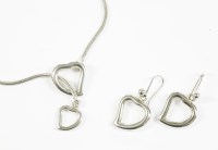 Lot 15 - A silver Yves Saint Laurent heart pendant necklace on a rat tail link chain