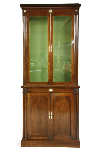 Lot 938 - A Victorian walnut book case cabinet