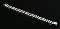 Lot 463 - A white gold two row diamond set Lucea bracelet by Bulgari