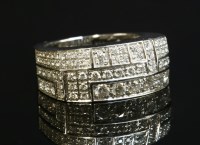 Lot 401 - A white gold diamond set band ring by Mauboussin