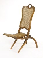 Lot 1017 - A walnut Victorian campaign chair