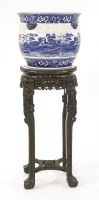 Lot 1111 - A Chinese hardwood jardinière stand with a Copeland Spode jardinière