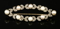 Lot 160 - A Belle Époque pearl and diamond wreath brooch of elliptical form
