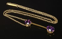 Lot 105 - A gold two stone amethyst Edna May pendant