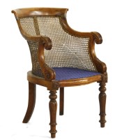Lot 1039 - A William IV mahogany bergere library chair