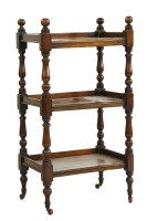 Lot 1136 - A Victorian mahogany three tier whatnot on turned supports