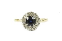 Lot 203 - An 18ct gold round cut sapphire and diamond cluster ring
