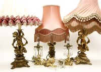 Lot 782 - A pair of decorative gilt metal table lamps