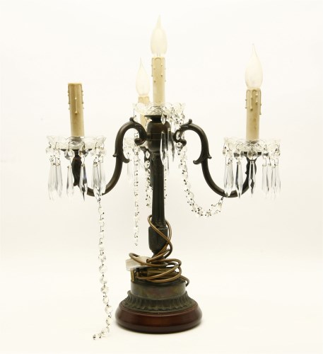 Lot 794 - A bronzed three branch four light candelabra