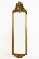 Lot 1010 - A narrow gilt mirror