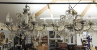 Lot 996 - A pair of five branch chandeliers