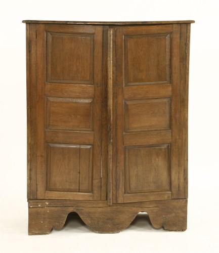 Lot 1044 - An oak panelled cupboard