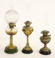 Lot 694 - Three Victorian oil lamps