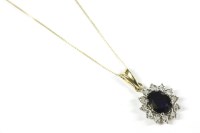 Lot 234 - A 9ct gold sapphire and diamond oval cluster pendant and chain
