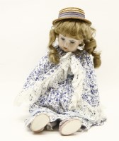 Lot 786 - A porcelain headed doll