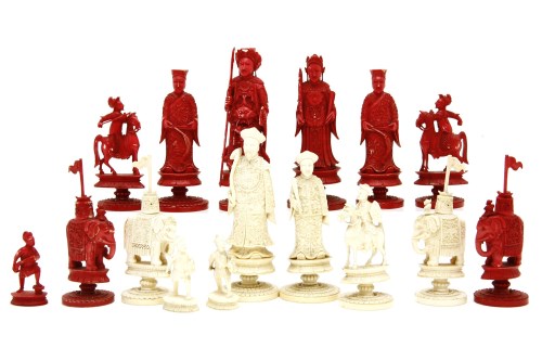 Lot 454 - A late 19th century carved ivory part chess set