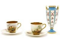 Lot 473 - A pair of Royal Worcester cups and saucers