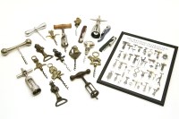 Lot 381 - A collection of nine brass figural finger pull corkscrews