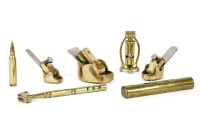 Lot 350 - Three miniature brass violin maker's thumb planes