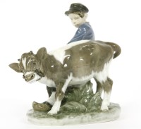 Lot 503 - A Royal Copenhagen figure of a boy and calf