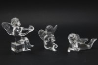 Lot 453 - Three Baccarat crystal ornaments in the form of cherubs
