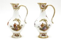 Lot 460 - A pair of Continental porcelain ewers