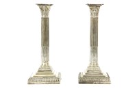 Lot 425 - A pair of hallmarked silver Corinthian column candlesticks