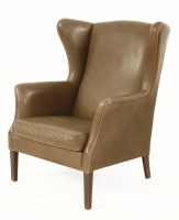 Lot 523 - A Danish leather wing back armchair