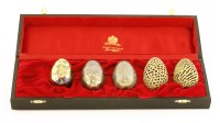 Lot 442 - Five silver gilt eggs