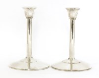 Lot 437 - A pair of silver candlesticks