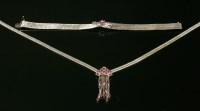 Lot 261 - An Italian three row diamond and ruby white feather link bracelet