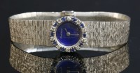 Lot 264 - A ladies' 9ct white gold sapphire and diamond set Beuche Girod mechanical watch