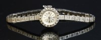 Lot 248 - A ladies' 18ct white gold Damas mechanical cocktail watch