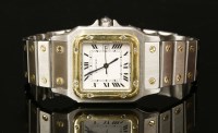 Lot 554 - A bi-colour mid-size Cartier Santos automatic bracelet watch