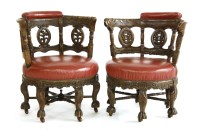 Lot 1162 - A pair of Victorian carved oak armchairs
